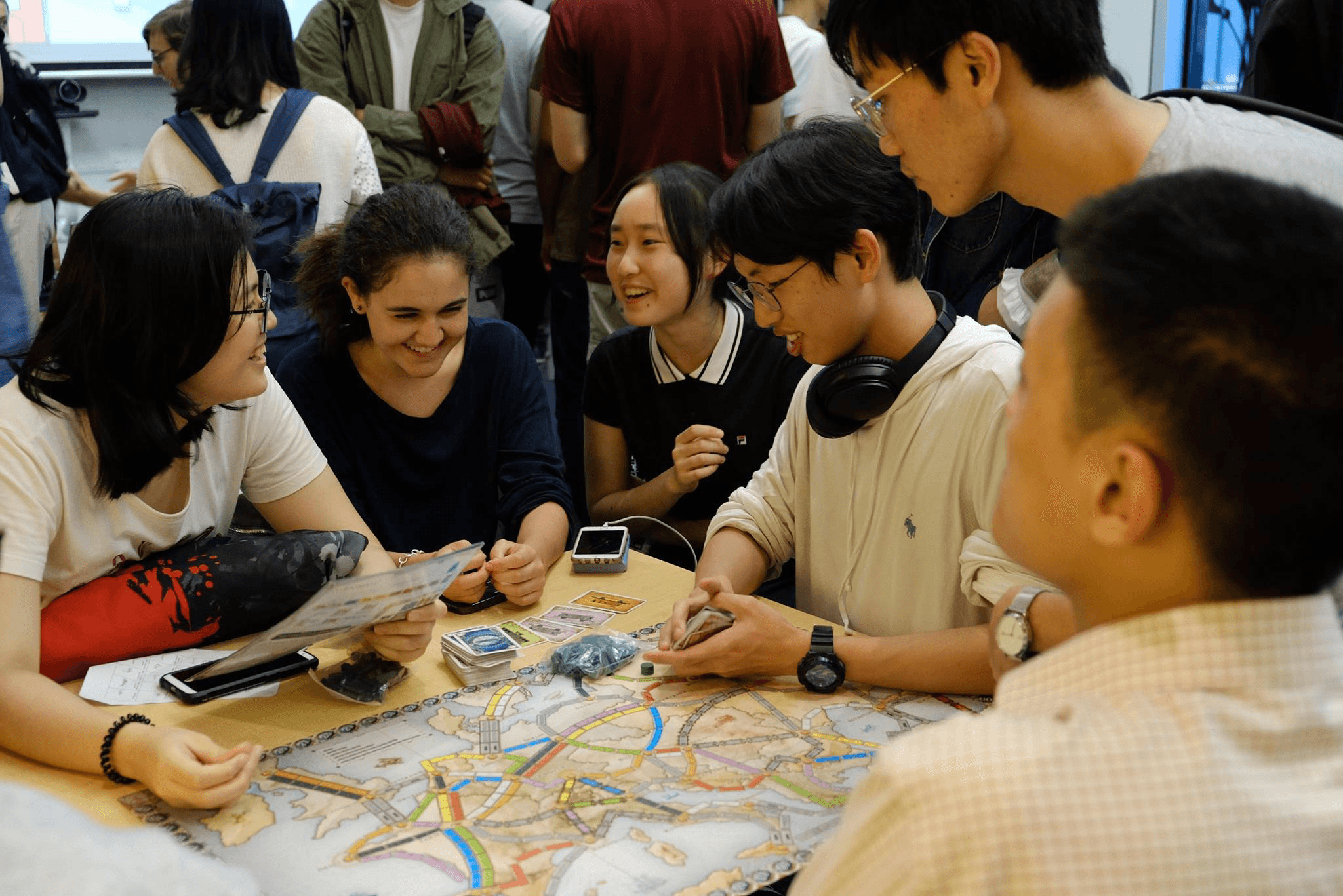 Students playing the card game Uno